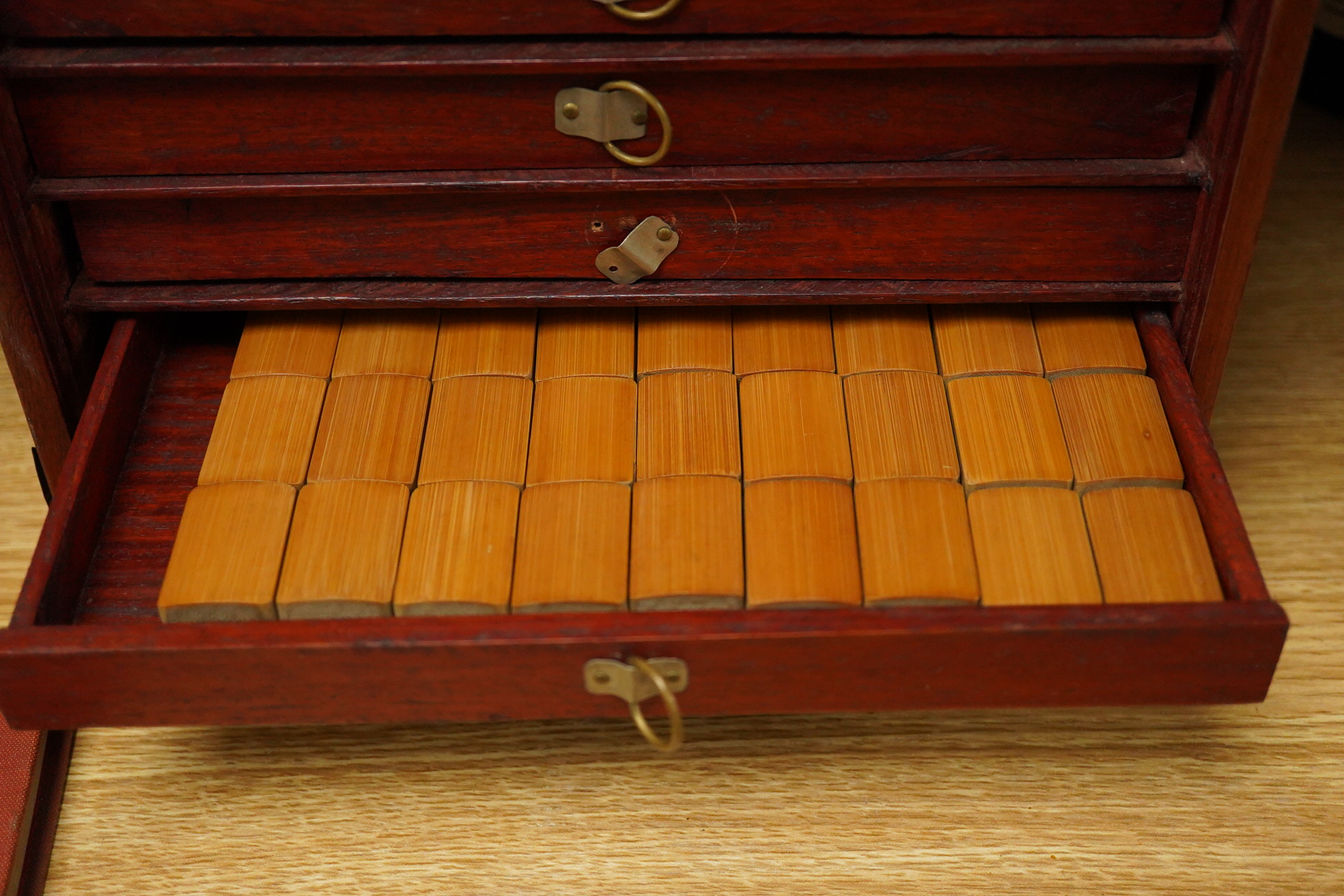 A Mah jong set an related book 24cm x 16.5cm high